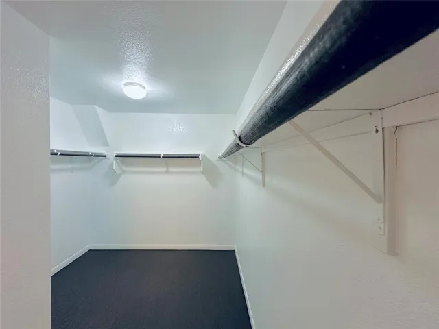 an empty room with a empty space and a window