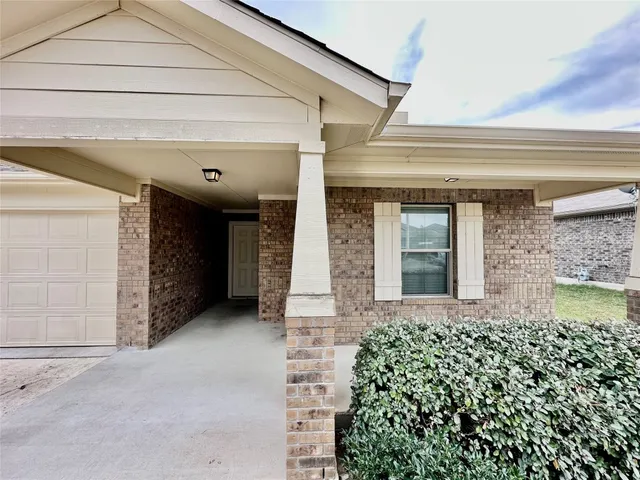 an entrance to house with yard