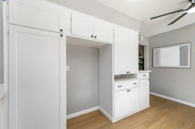 a view of cabinets and wooden floor