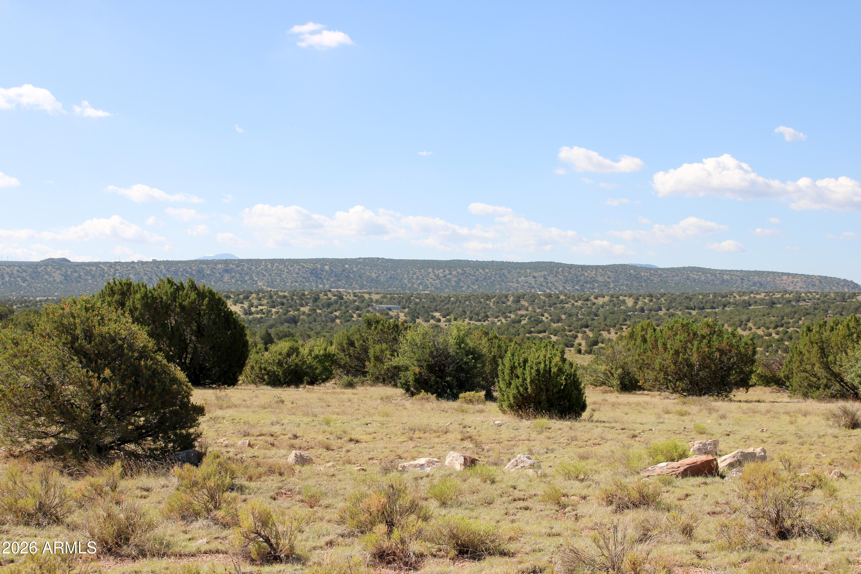 9360 Latigo Road Williams, AZ 86046 - Photo 12 of 16 a view of a lake with a mountain