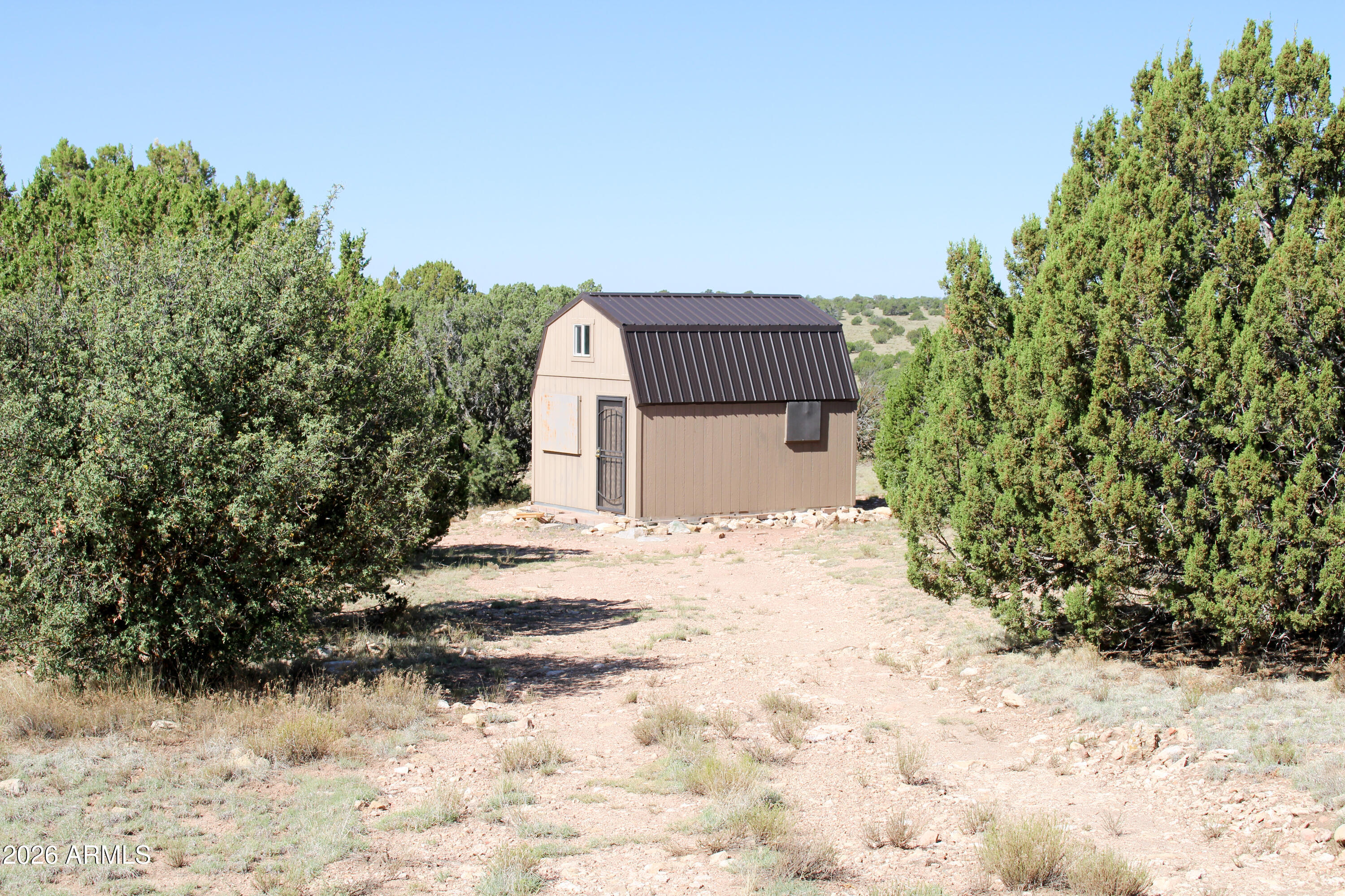 9360 Latigo Road Williams, AZ 86046 - Photo 8 of 16 a view of a house with a snow in the yard
