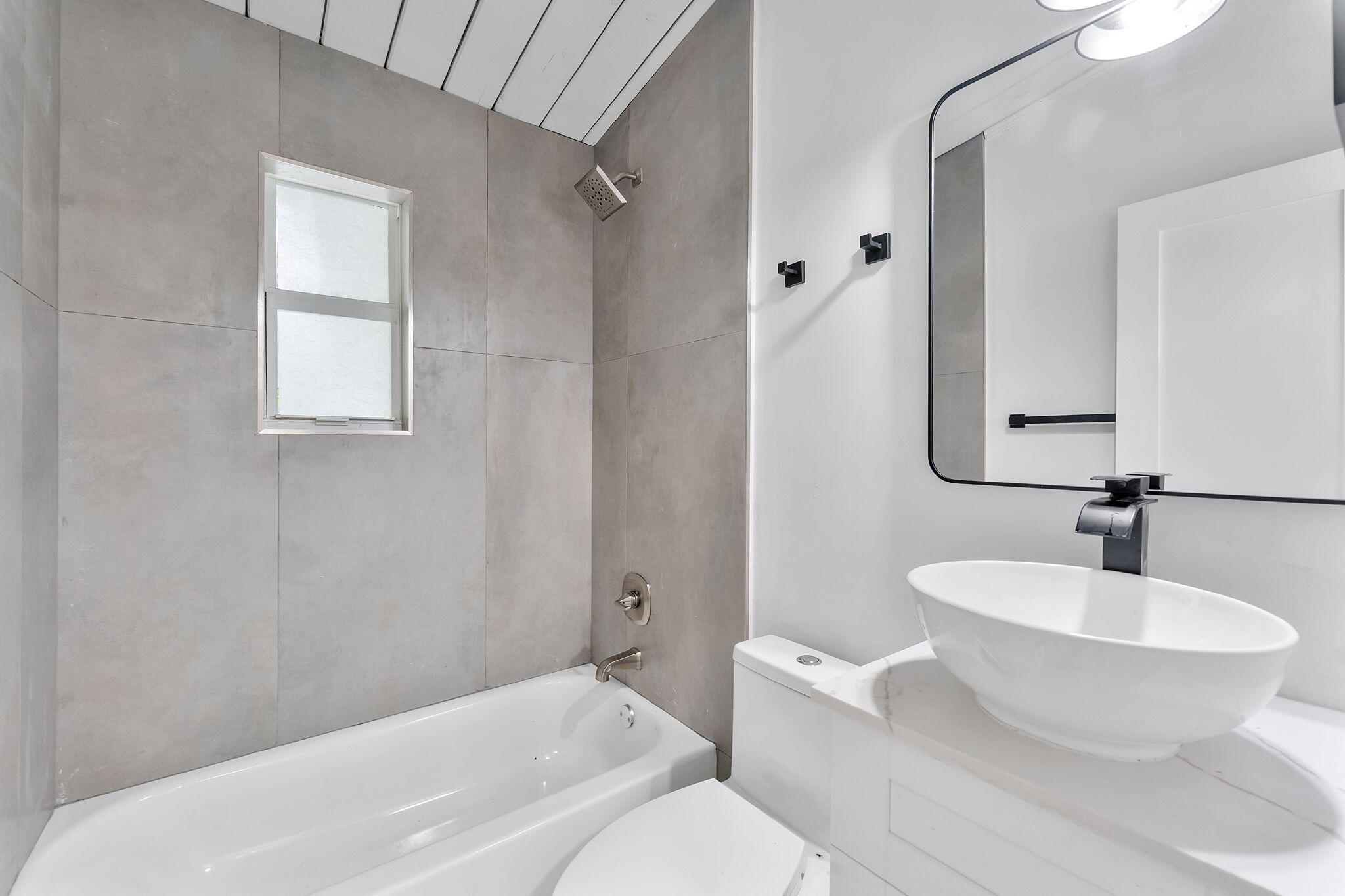 474 Enfield Street Boca Raton, FL 33487 - Photo 11 of 40 a bathroom with a sink and a mirror