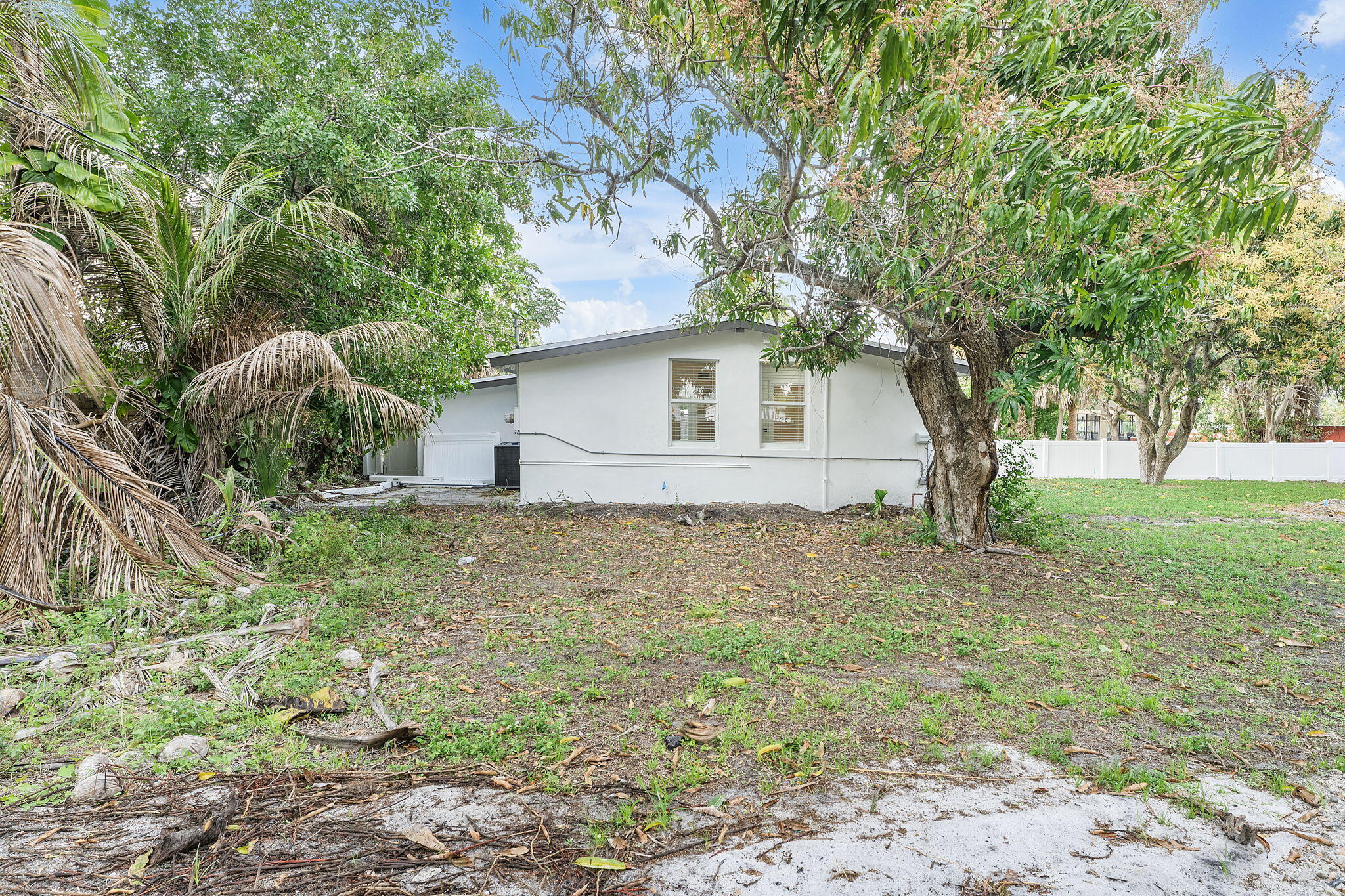 474 Enfield Street Boca Raton, FL 33487 - Photo 15 of 40 a house with lots of trees