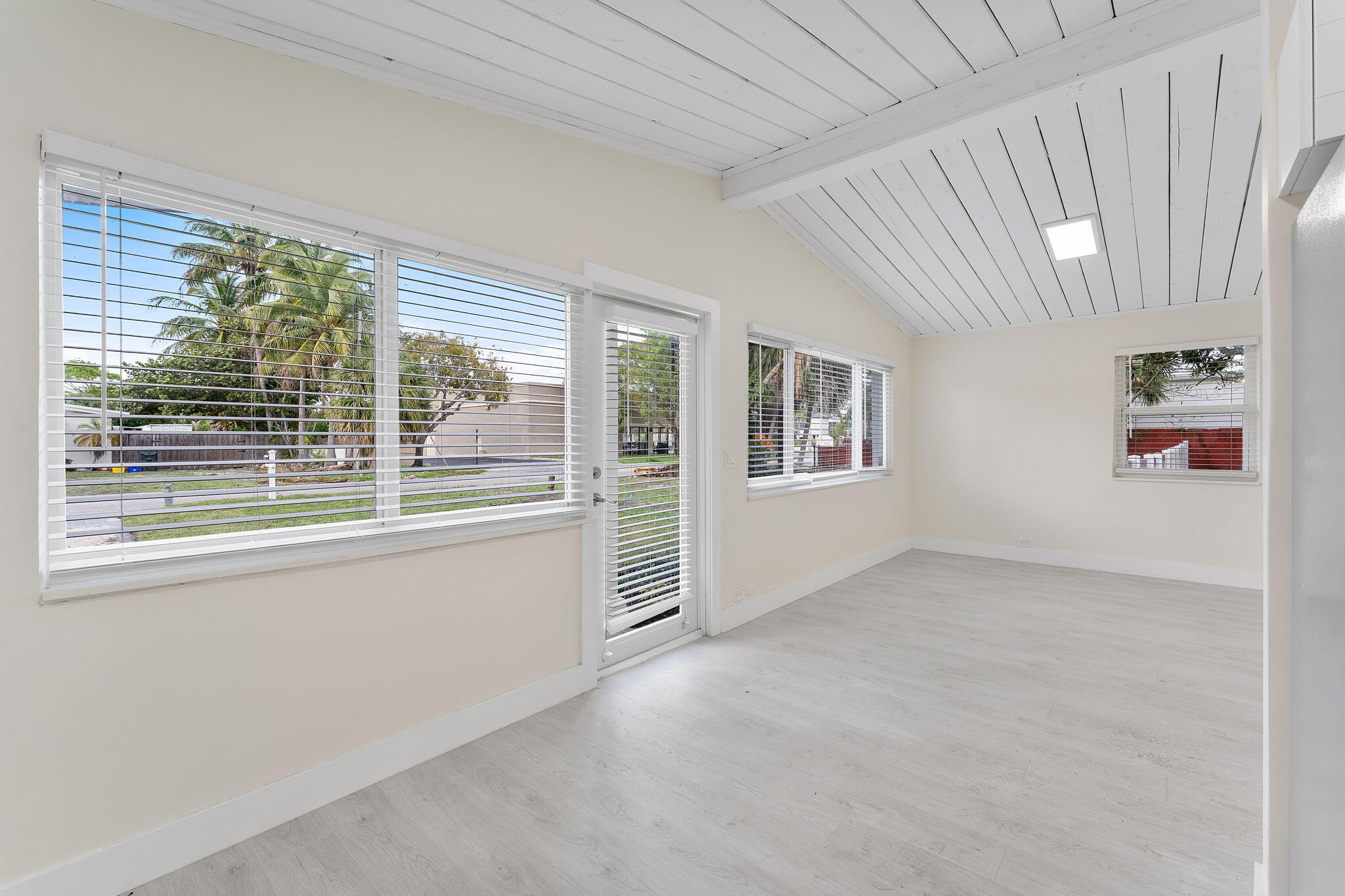 474 Enfield Street Boca Raton, FL 33487 - Photo 20 of 40 a view of empty room with floor to ceiling window and windows
