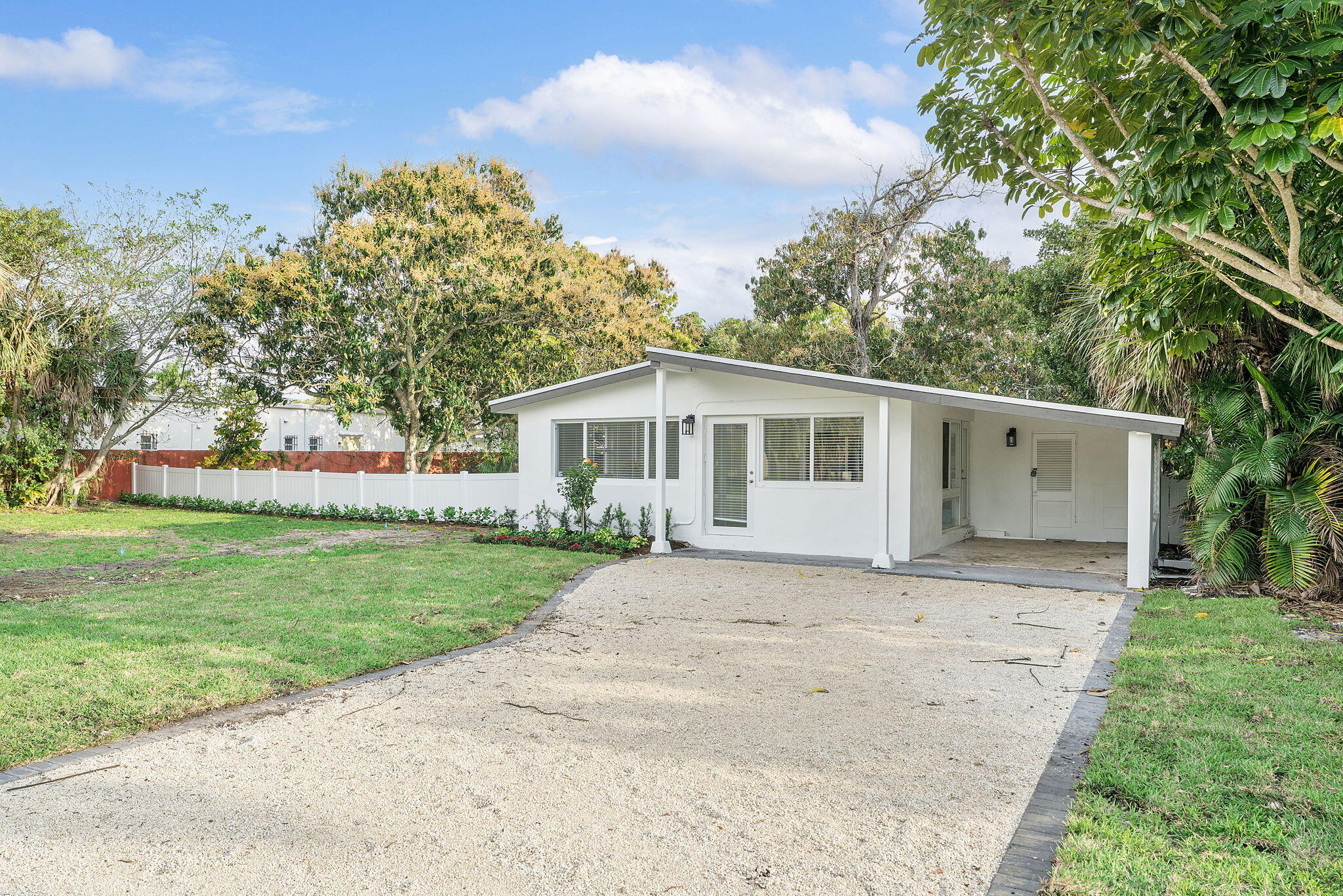 474 Enfield Street Boca Raton, FL 33487 - Photo 2 of 40 a white house that has a tree in it