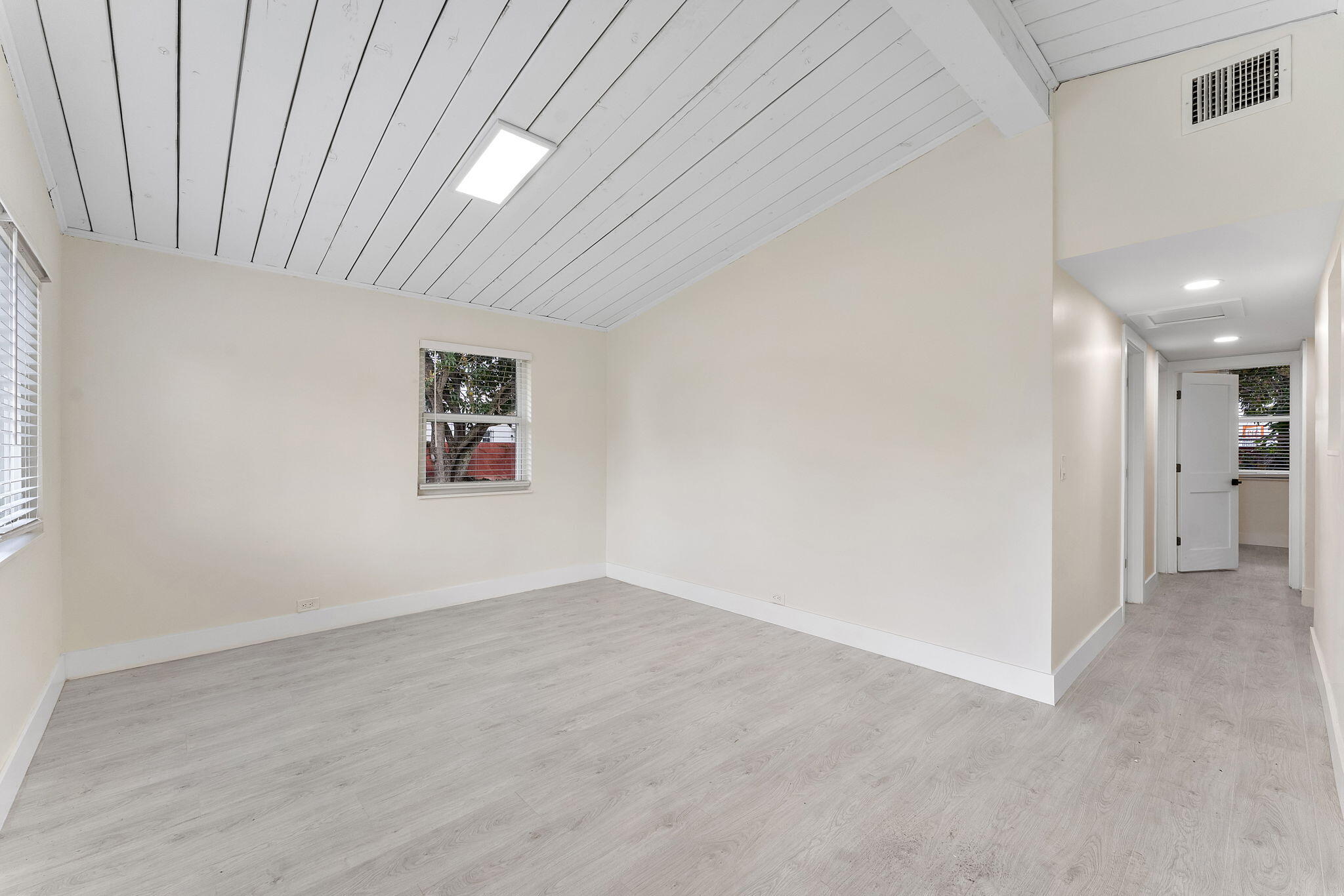 474 Enfield Street Boca Raton, FL 33487 - Photo 23 of 40 wooden floor in an empty room with a window