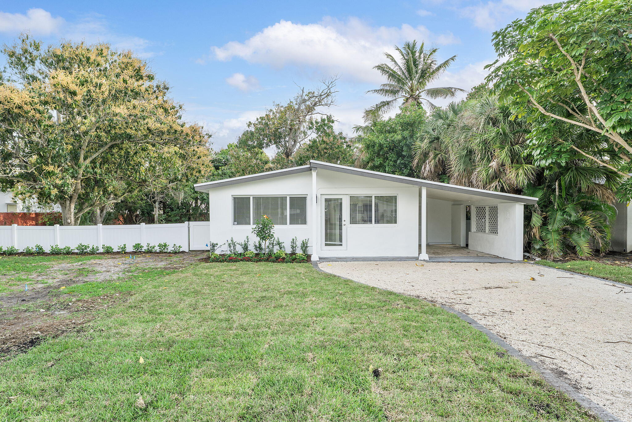474 Enfield Street Boca Raton, FL 33487 - Photo 3 of 40 a front view of house with yard and trees