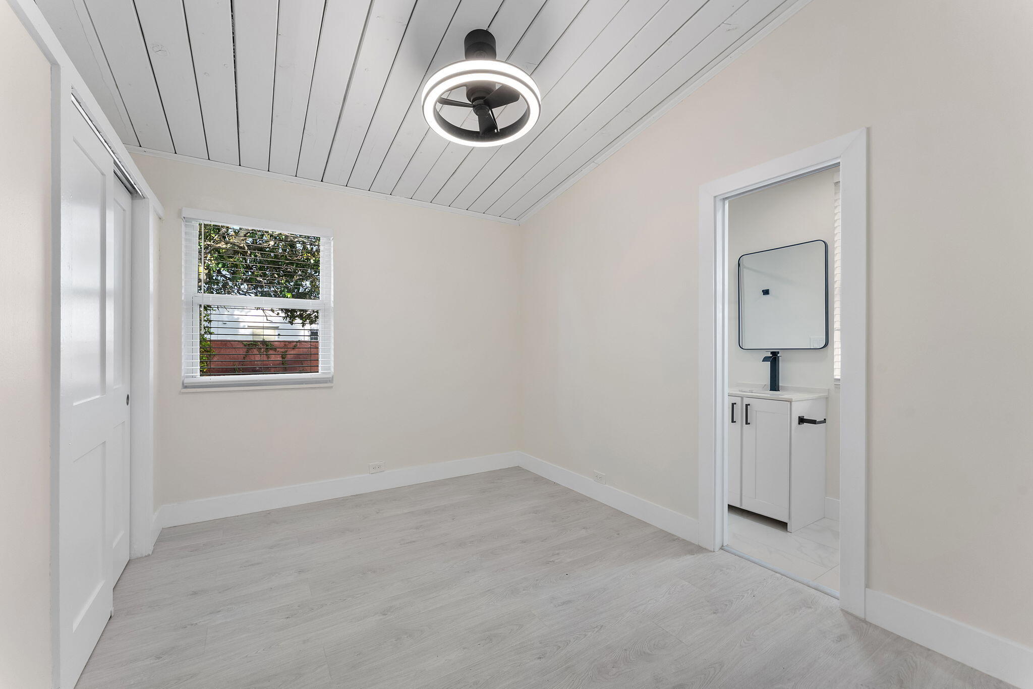 474 Enfield Street Boca Raton, FL 33487 - Photo 7 of 40 an empty room with windows and closet