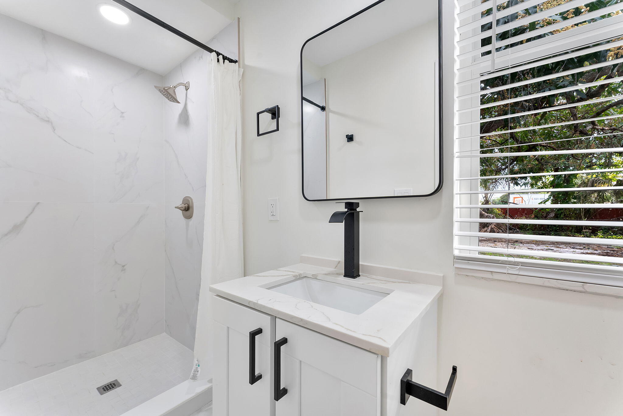474 Enfield Street Boca Raton, FL 33487 - Photo 9 of 40 a bathroom with a sink and a shower