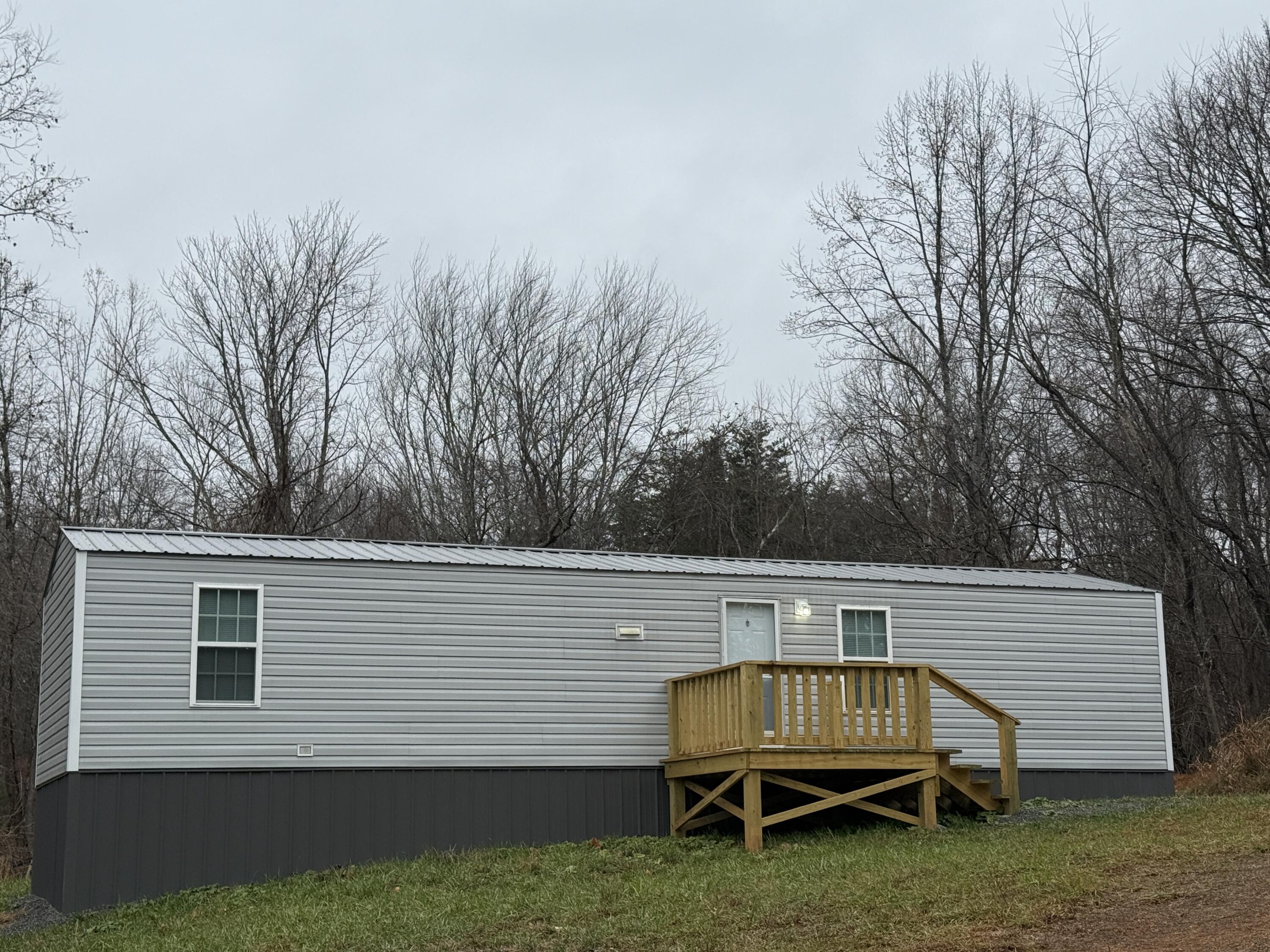 268 Briar Mountain Road Rocky Mount, VA 24151 - Photo 1 of 11 a view of backyard with deck and outdoor seating