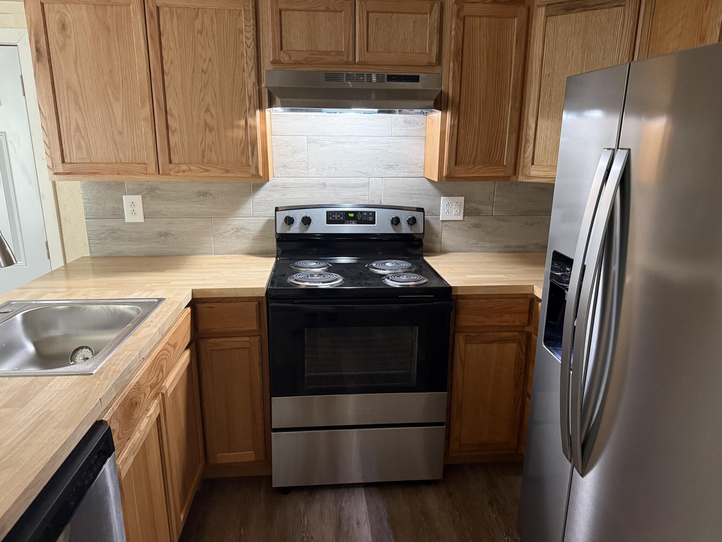 268 Briar Mountain Road Rocky Mount, VA 24151 - Photo 5 of 11 a kitchen with a stove microwave and refrigerator