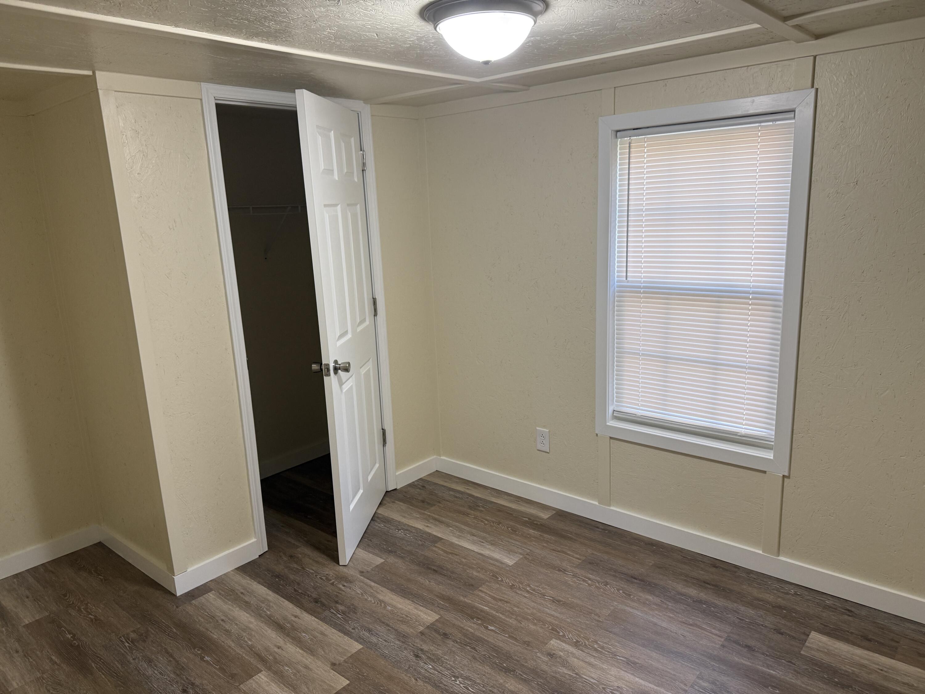 268 Briar Mountain Road Rocky Mount, VA 24151 - Photo 10 of 11 an empty room with wooden floor and closet