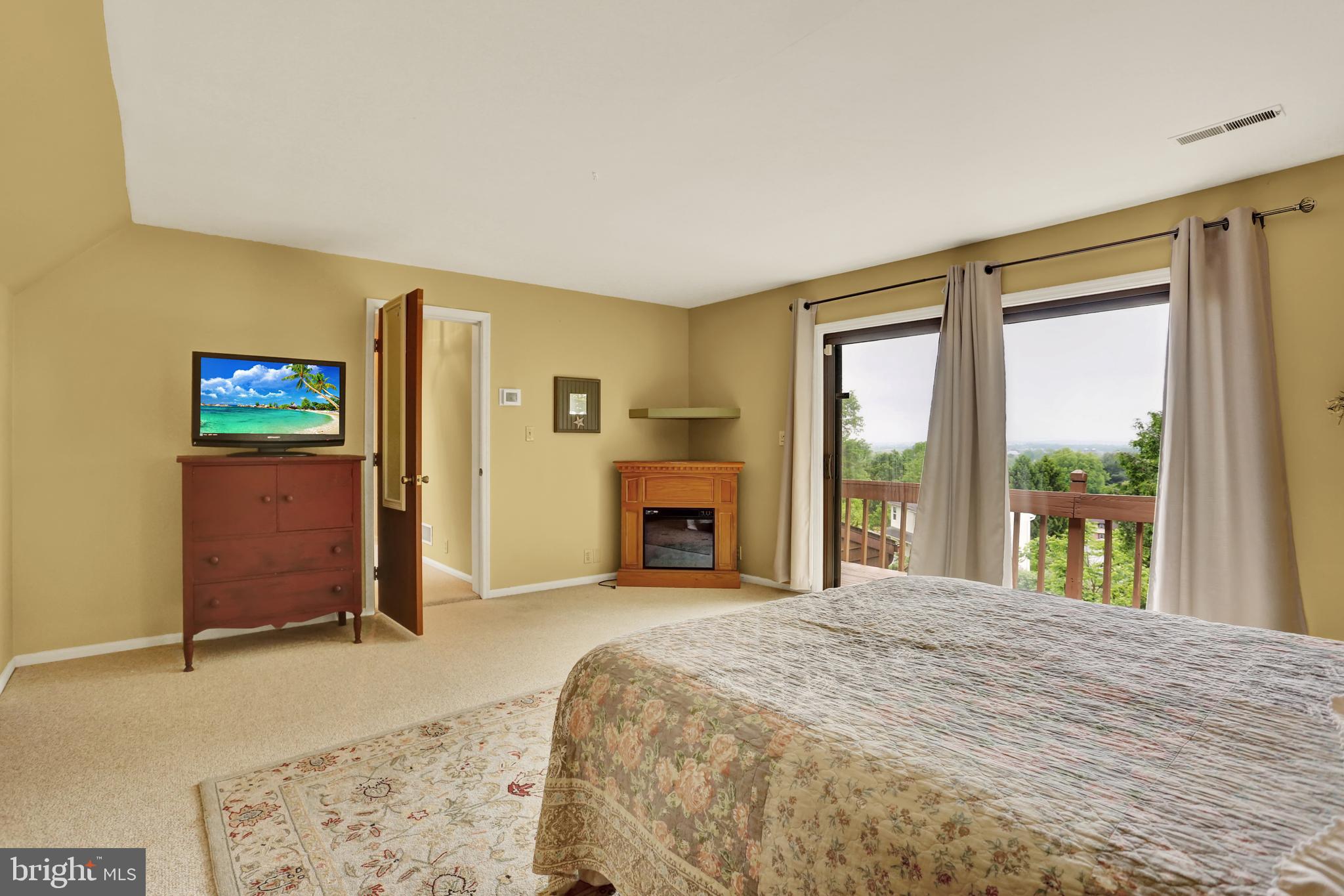 55 Karen Court Lititz, PA 17543 - Photo 23 of 36 a spacious bedroom with a large bed and a large window