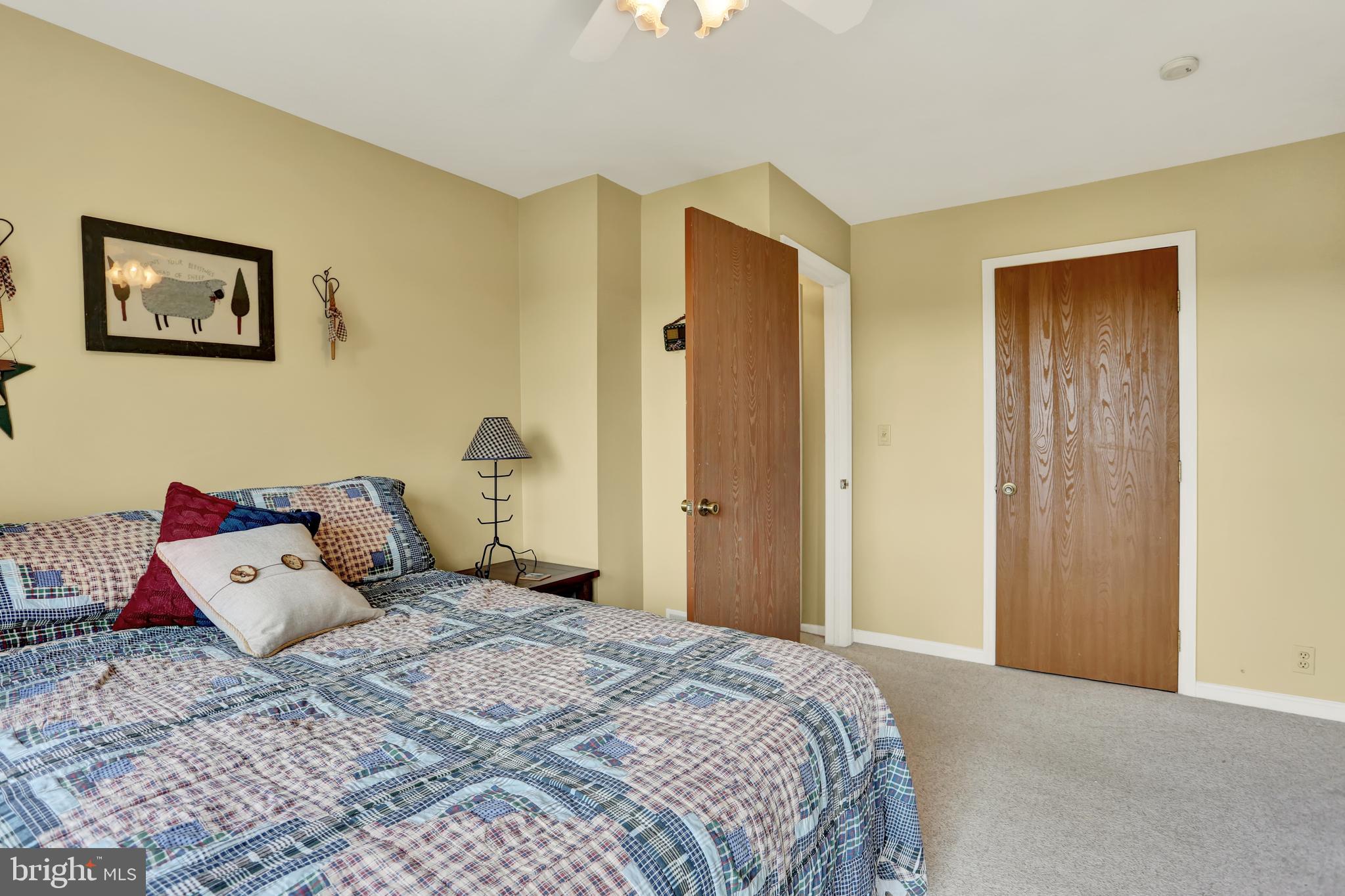 55 Karen Court Lititz, PA 17543 - Photo 27 of 36 a bedroom with a bed and a dresser