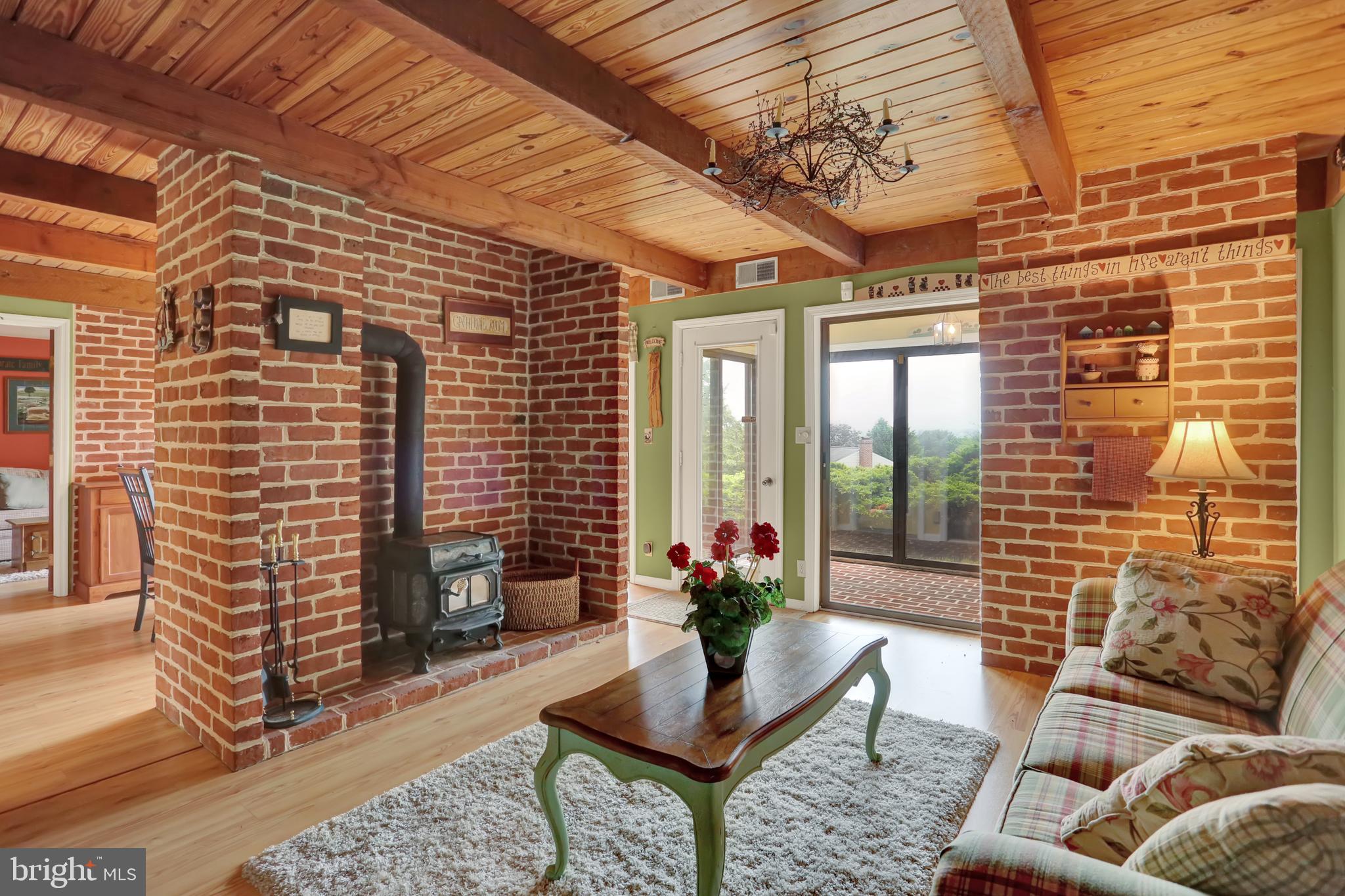 55 Karen Court Lititz, PA 17543 - Photo 7 of 36 a outdoor space with patio the couches and a dining table with large windows