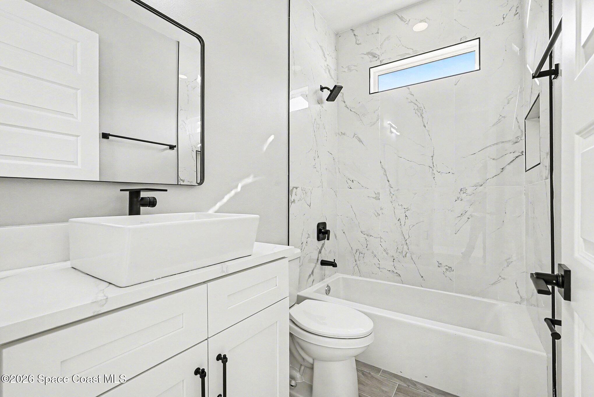 2713 Fields Avenue Southeast Palm Bay, FL 32909 - Photo 13 of 18 2725 Guest Bath 2