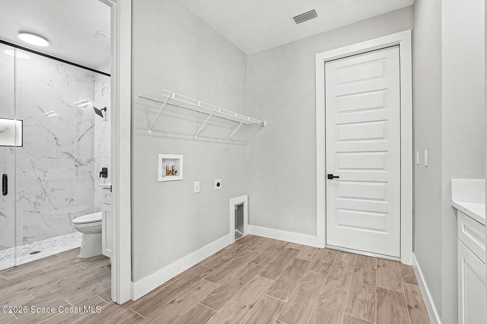 2713 Fields Avenue Southeast Palm Bay, FL 32909 - Photo 14 of 18 2725 Laundry Room