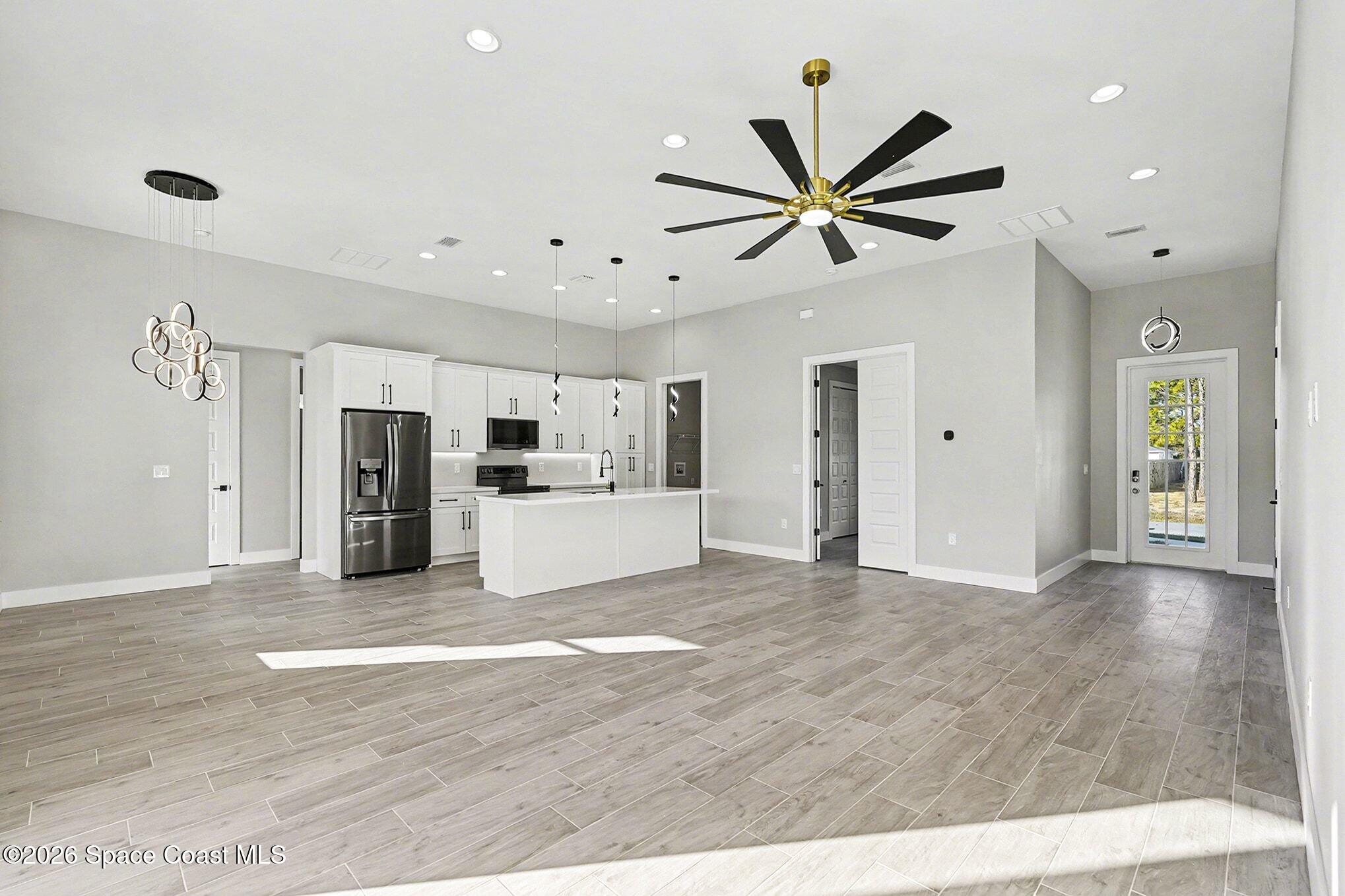 2713 Fields Avenue Southeast Palm Bay, FL 32909 - Photo 3 of 18 2725 Great Room2