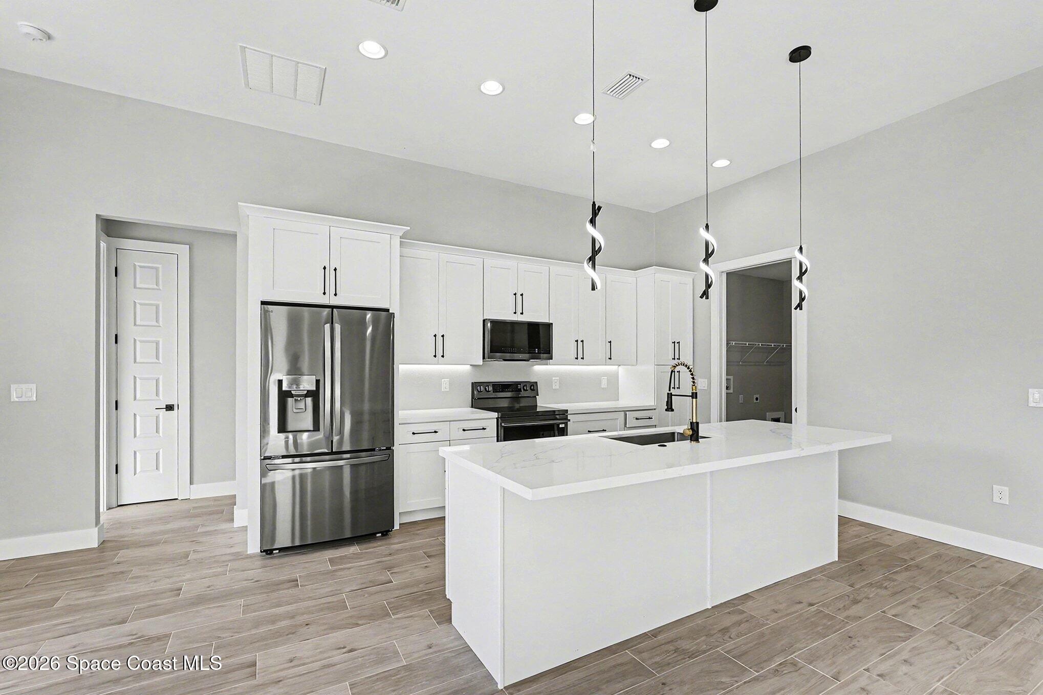 2713 Fields Avenue Southeast Palm Bay, FL 32909 - Photo 6 of 18 2725 Kitchen