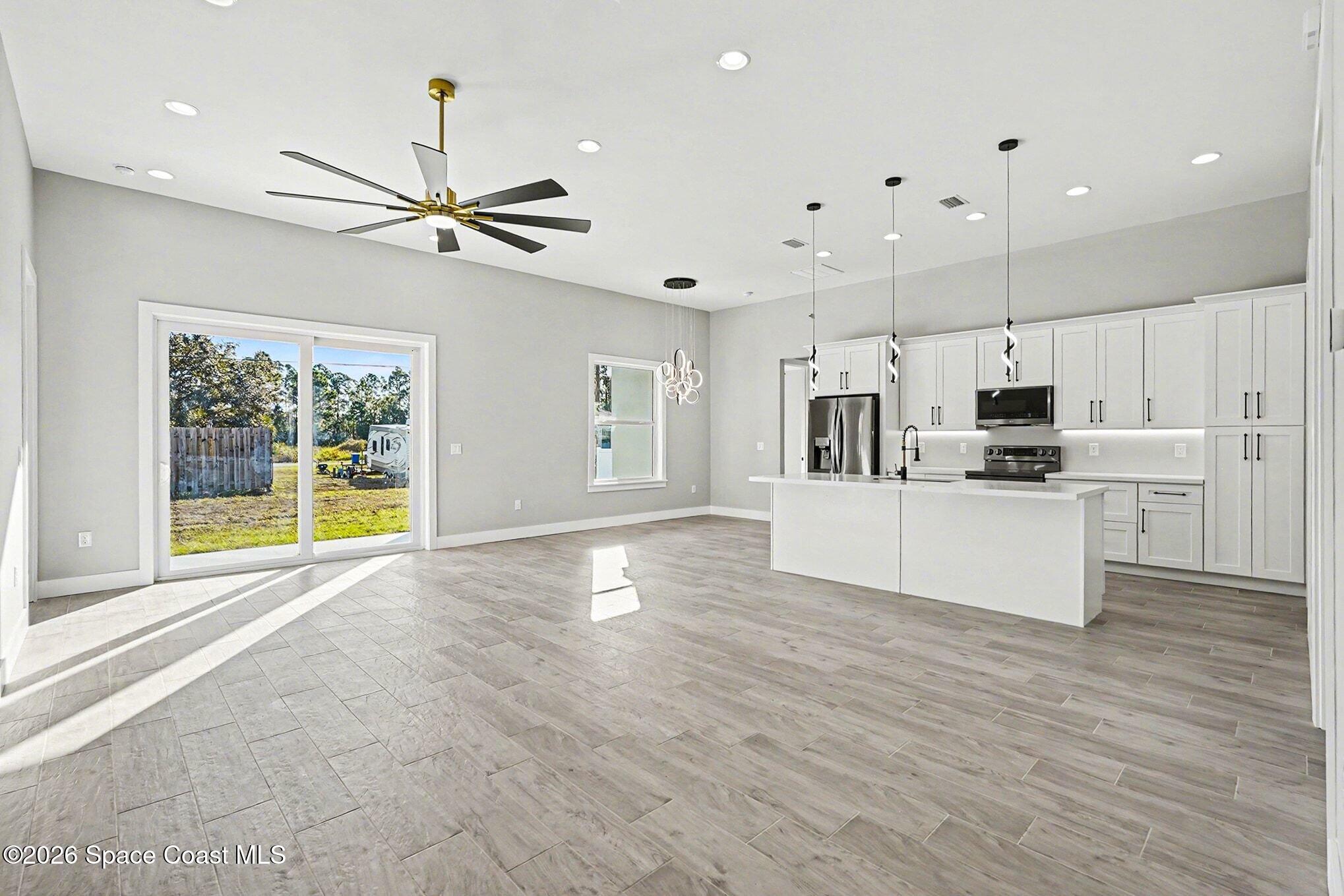 2713 Fields Avenue Southeast Palm Bay, FL 32909 - Photo 7 of 18 2725 Great Room