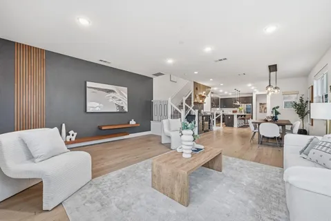 a living room with furniture and a table