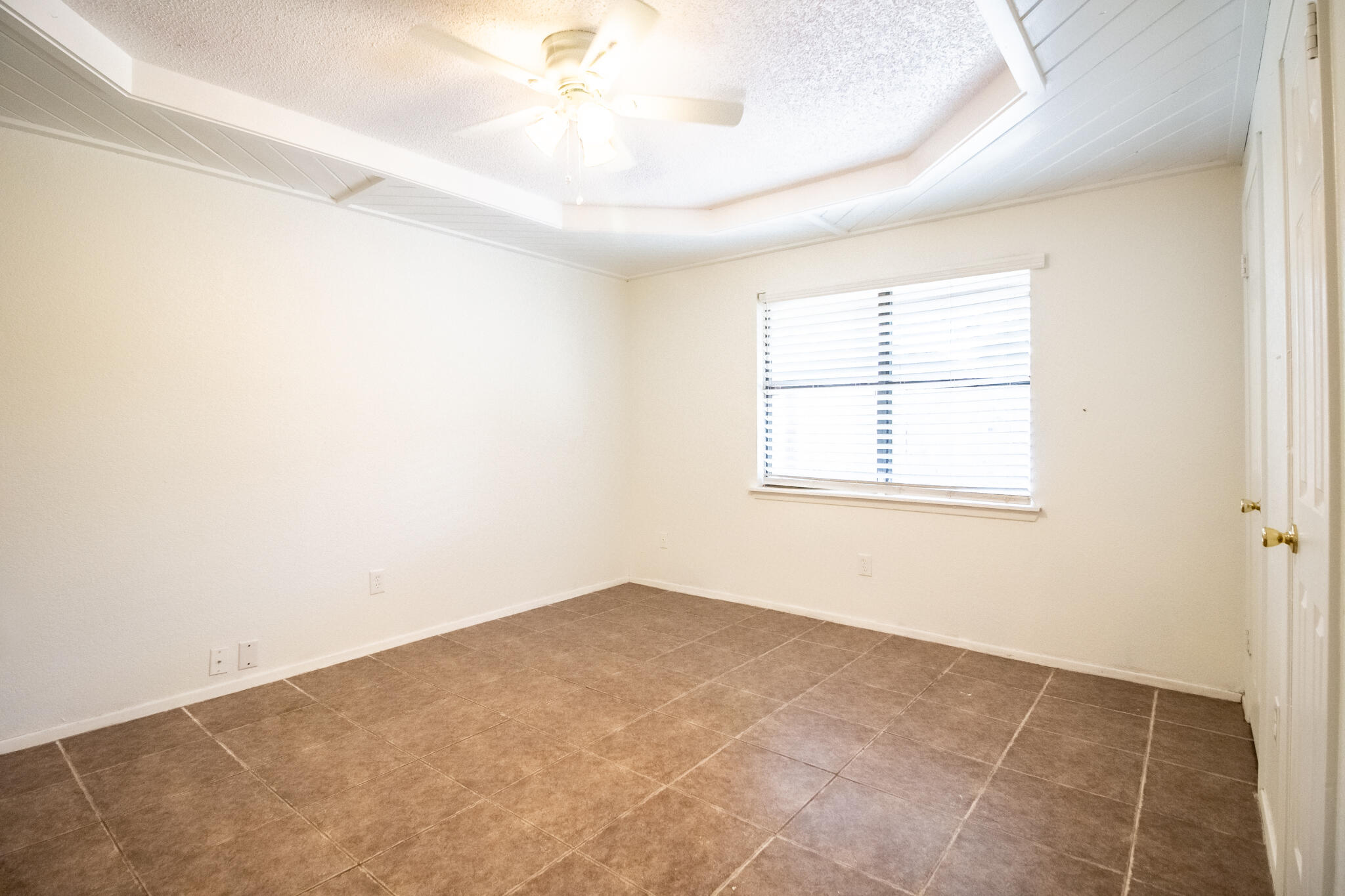6103 38th Street, Unit B Lubbock, TX 79407 - Photo 7 of 11 an empty room with windows and closet