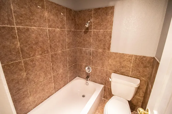 a bathroom with a toilet and sink