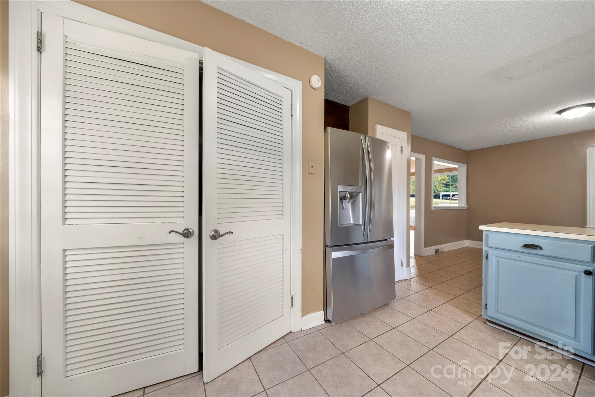8101 Plott Road Charlotte, NC 28215 - Photo 14 of 34 a kitchen with stainless steel appliances granite countertop a refrigerator and a sink