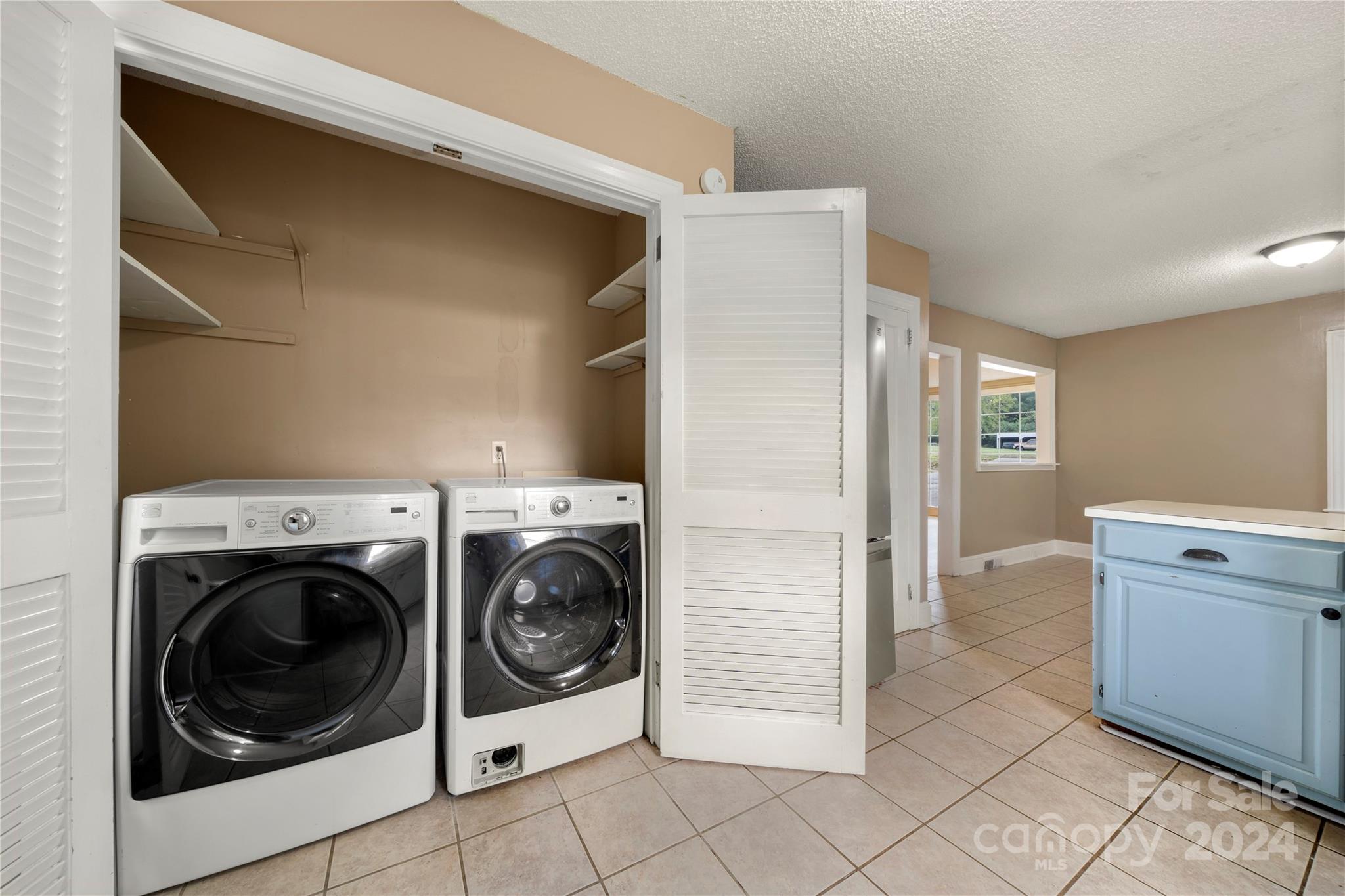 8101 Plott Road Charlotte, NC 28215 - Photo 15 of 34 a view of a kitchen with washer and dryer