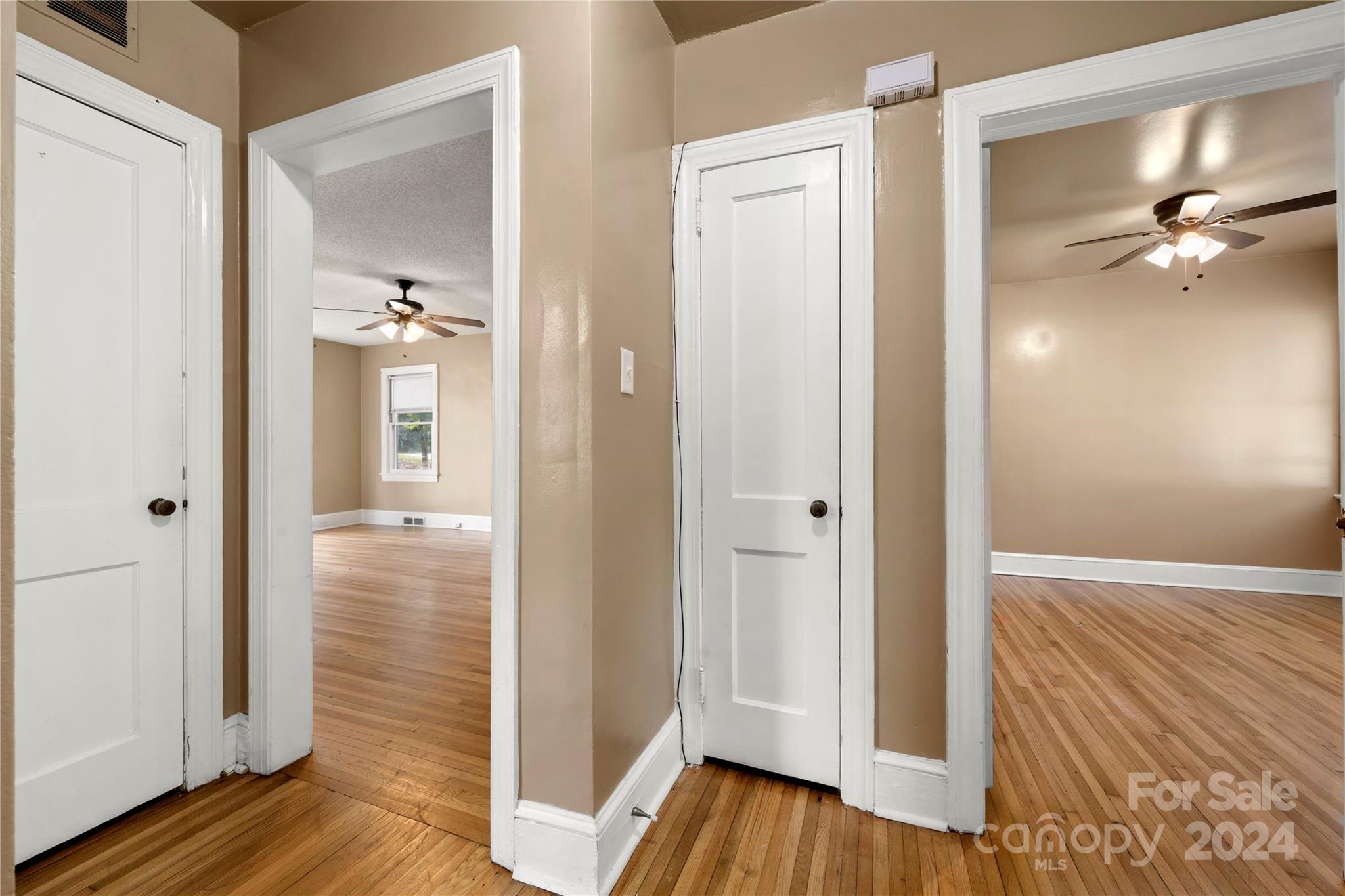 8101 Plott Road Charlotte, NC 28215 - Photo 19 of 34 a view of a hallway with wooden floor and closet area