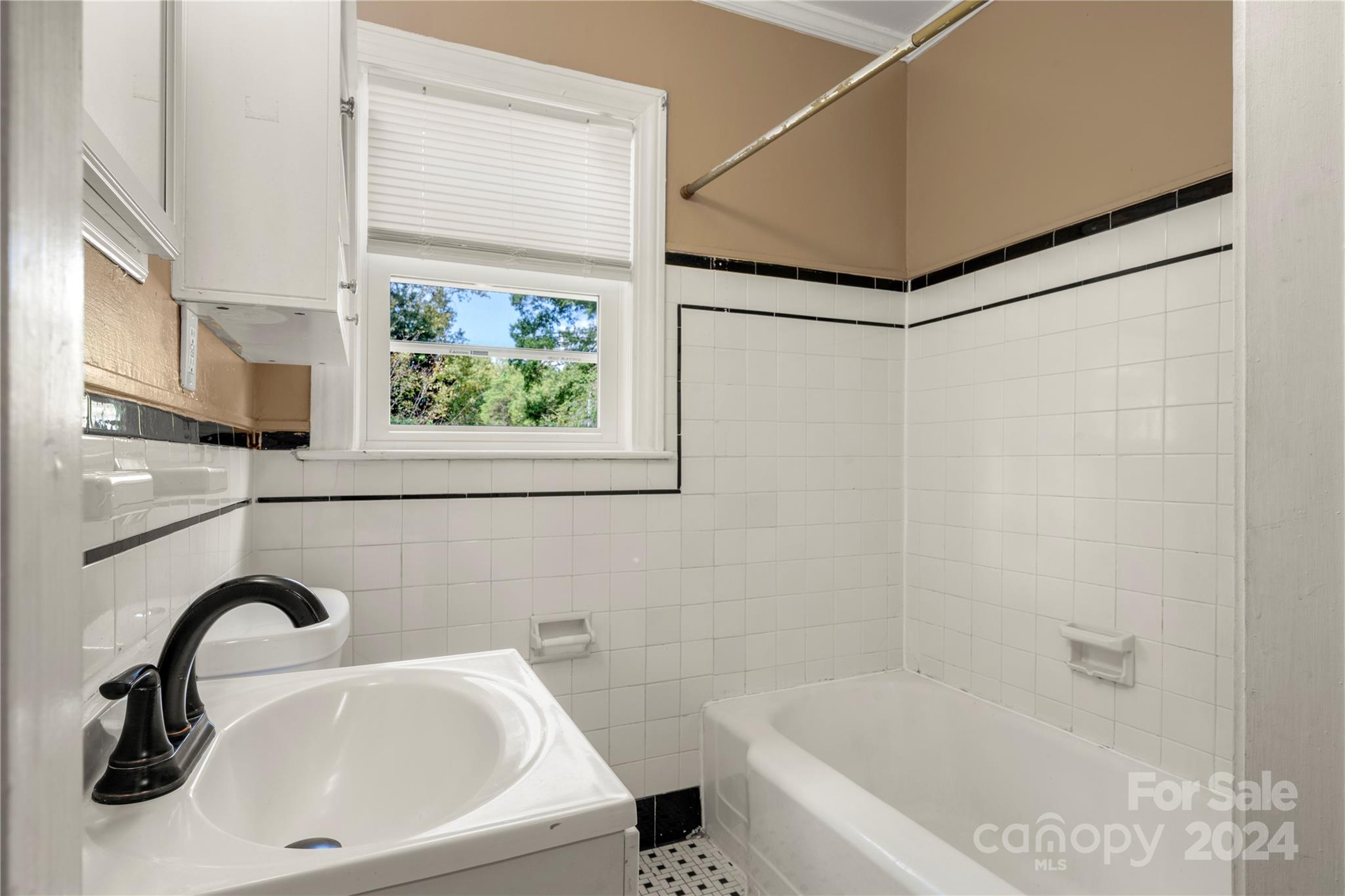 8101 Plott Road Charlotte, NC 28215 - Photo 20 of 34 a bathroom with a sink and a bathtub