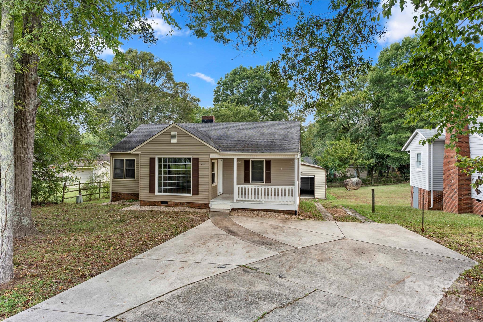 8101 Plott Road Charlotte, NC 28215 - Photo 2 of 34 front view of a house with a yard