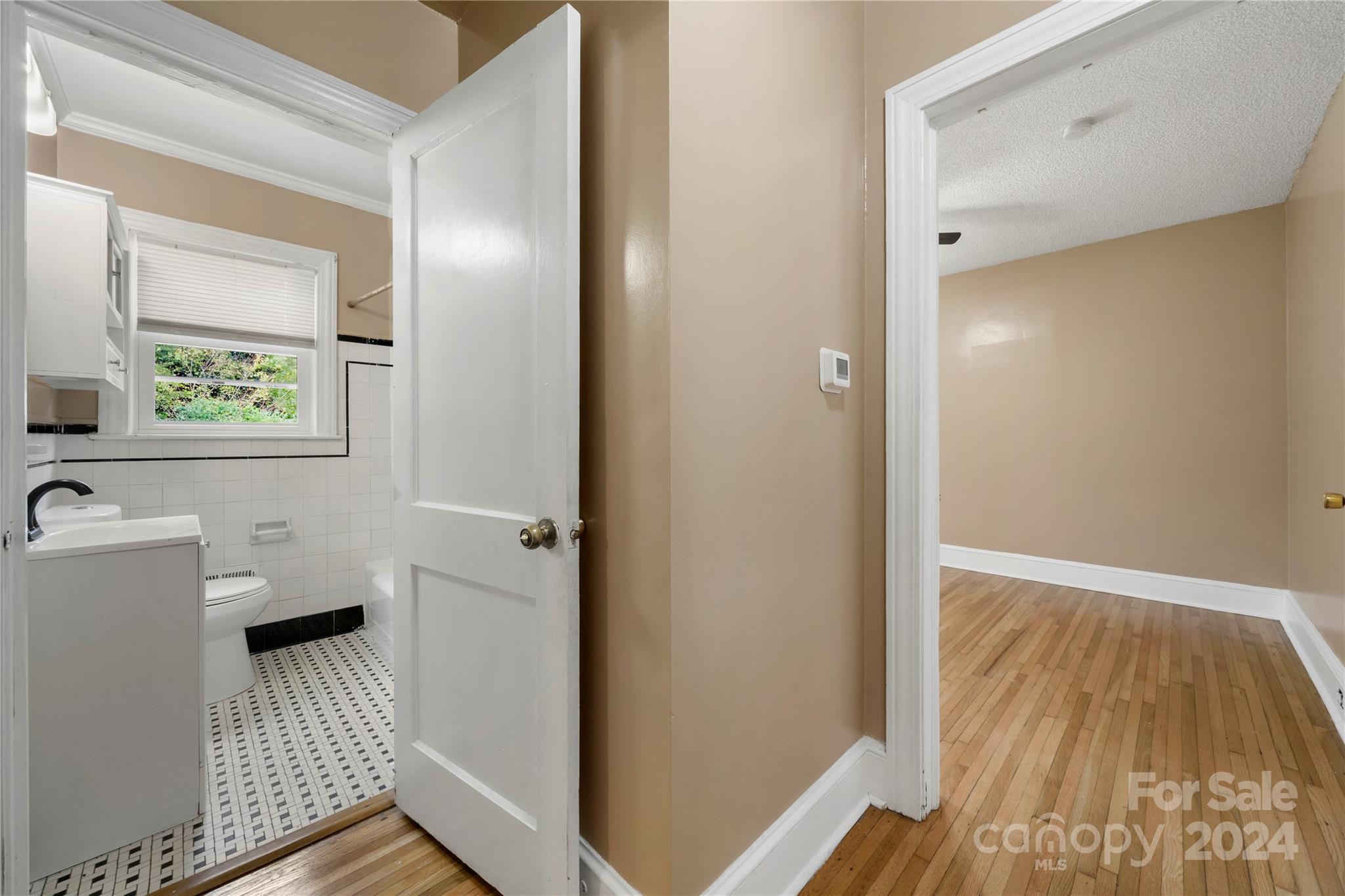 8101 Plott Road Charlotte, NC 28215 - Photo 21 of 34 a bathroom with a sink and a window
