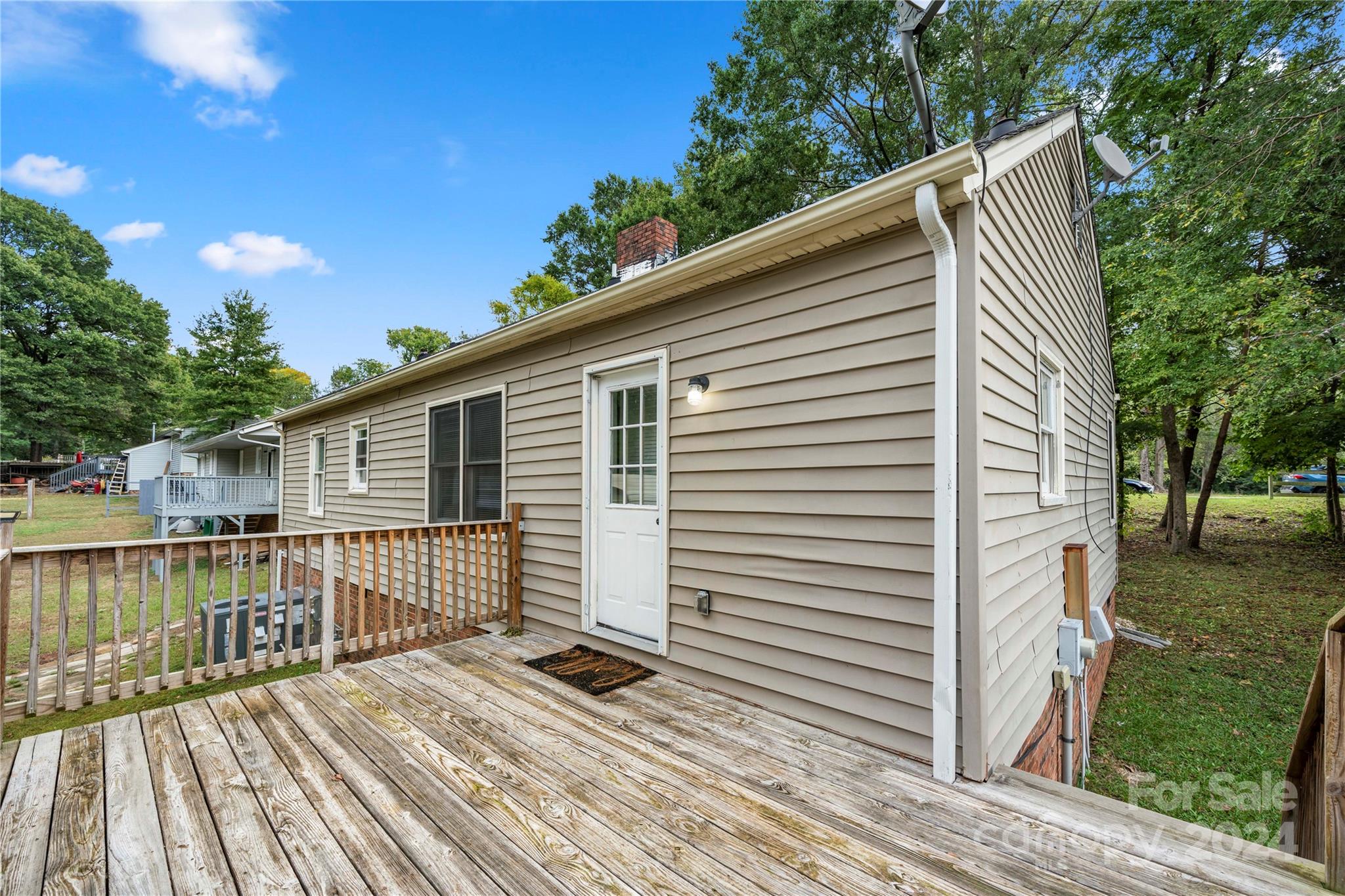 8101 Plott Road Charlotte, NC 28215 - Photo 28 of 34 a view of a house with backyard and deck