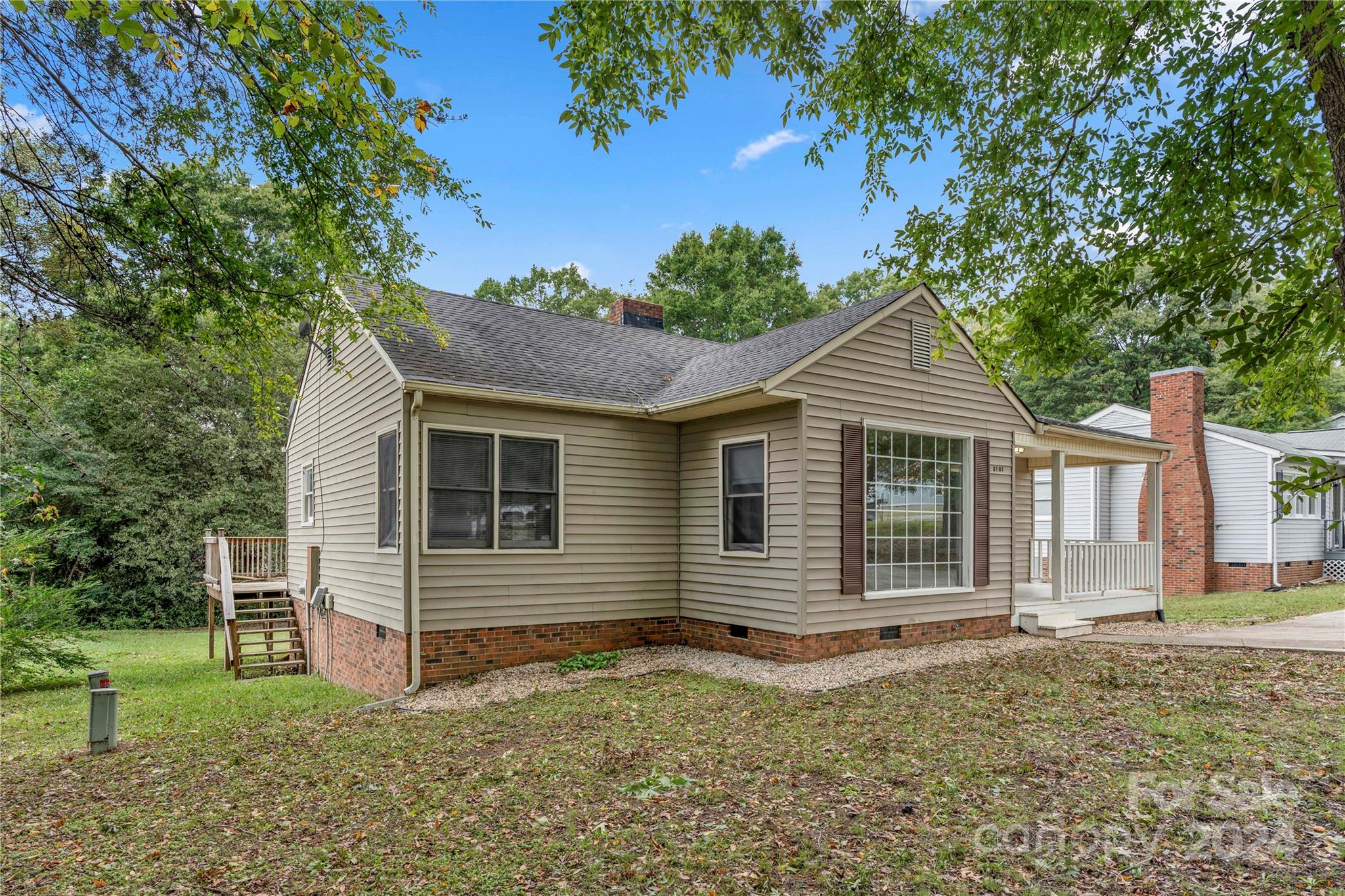 8101 Plott Road Charlotte, NC 28215 - Photo 3 of 34 a view of a house with a yard