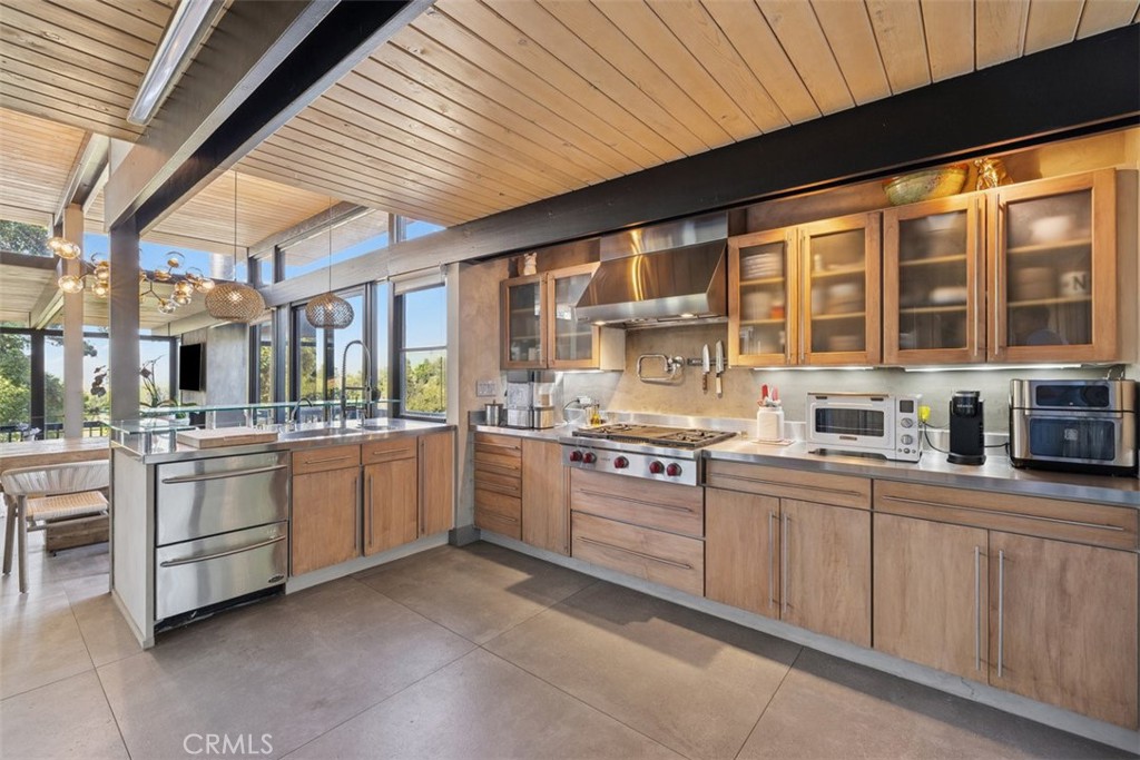 21090 Rios Street Woodland Hills, CA 91364 - Photo 19 of 61 a kitchen with sink and cabinets