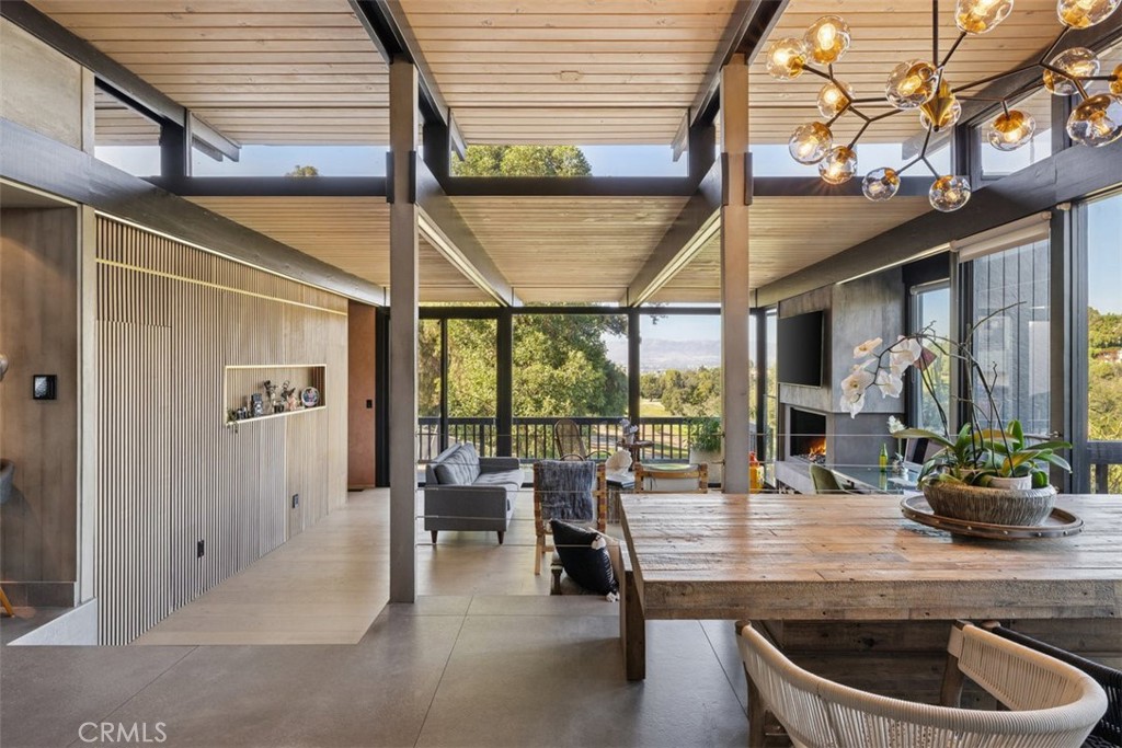 21090 Rios Street Woodland Hills, CA 91364 - Photo 23 of 61 a dining room with furniture and a large window
