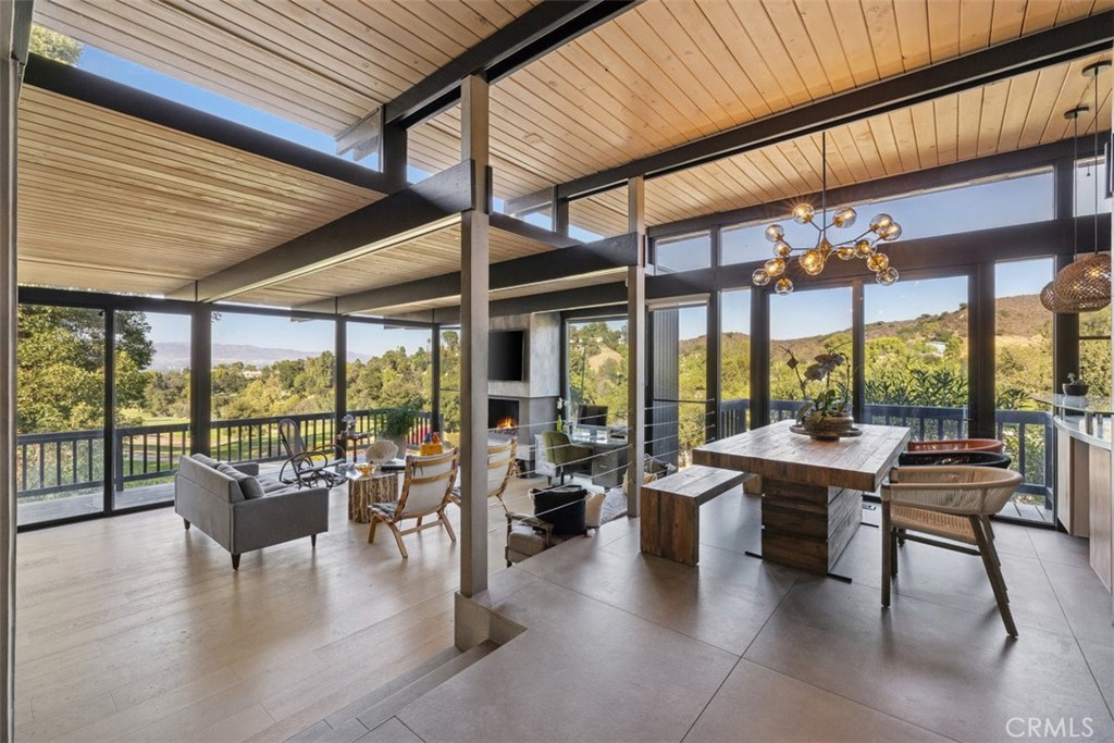21090 Rios Street Woodland Hills, CA 91364 - Photo 27 of 61 a living room with furniture and floor to ceiling windows