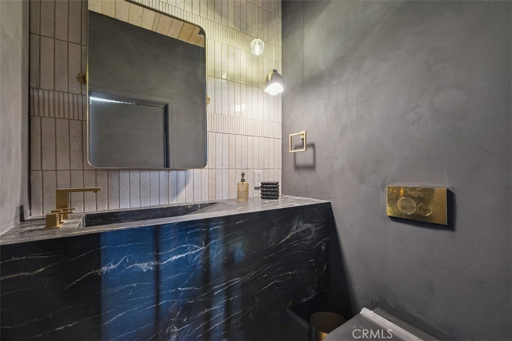 21090 Rios Street Woodland Hills, CA 91364 - Photo 28 of 61 a bathroom with a sink and a mirror