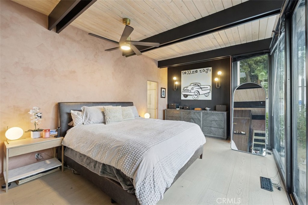 21090 Rios Street Woodland Hills, CA 91364 - Photo 31 of 61 a bedroom with a bed and a mirror