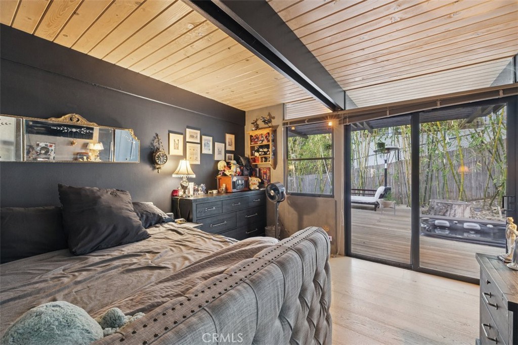 21090 Rios Street Woodland Hills, CA 91364 - Photo 33 of 61 a bedroom with furniture and large windows