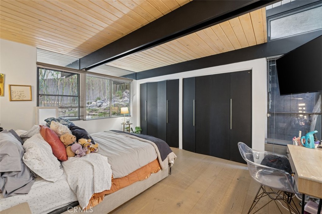 21090 Rios Street Woodland Hills, CA 91364 - Photo 35 of 61 a bedroom with a bed and a television