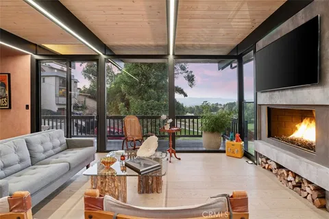 a room with lots of center island and large windows