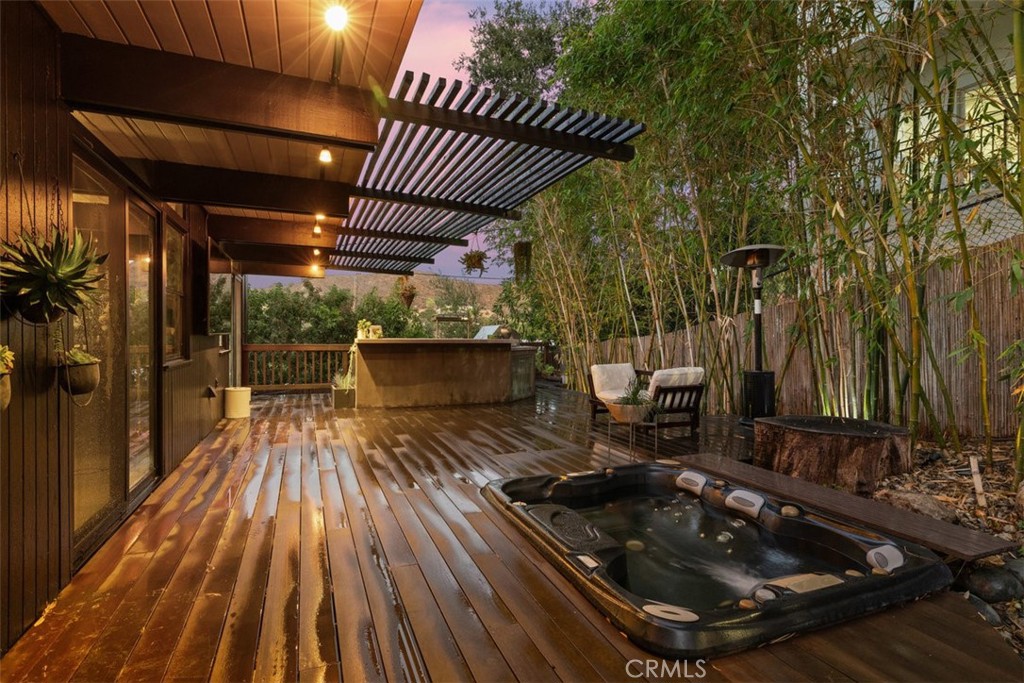 21090 Rios Street Woodland Hills, CA 91364 - Photo 59 of 61 a room with water heater and wooden floor