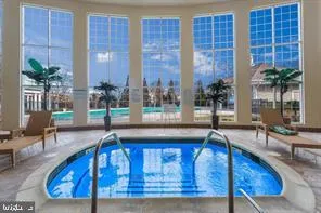 a view of a living room and floor to ceiling window or kitchen