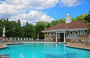 a view of living room and kitchen with windows