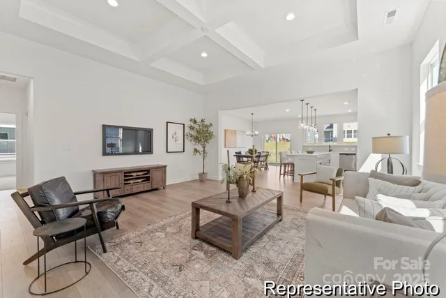 a living room with furniture and a chair