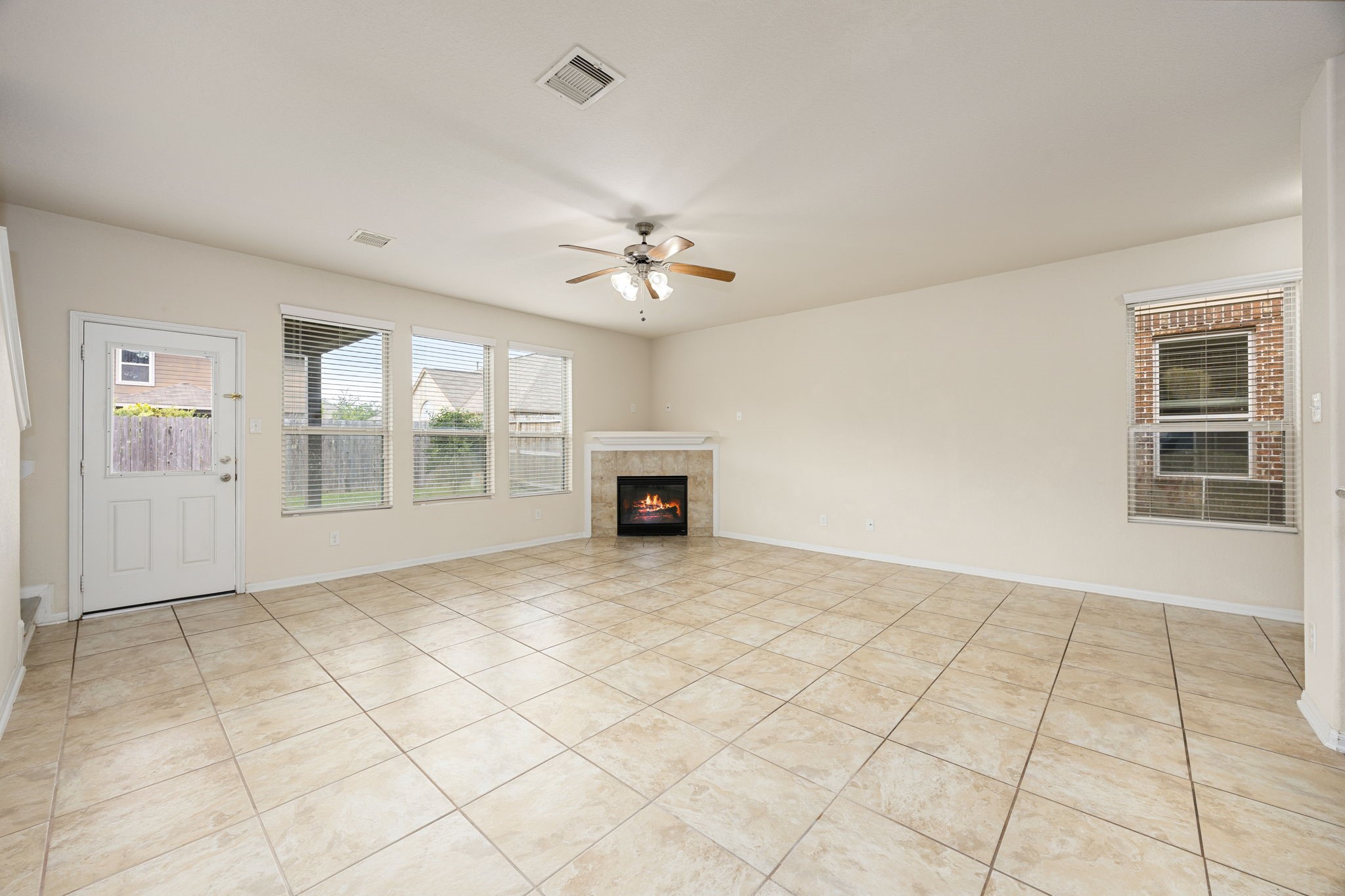 29322 Indian Clearing Spring, TX 77386 - Photo 11 of 47 a view of an empty room with a fireplace