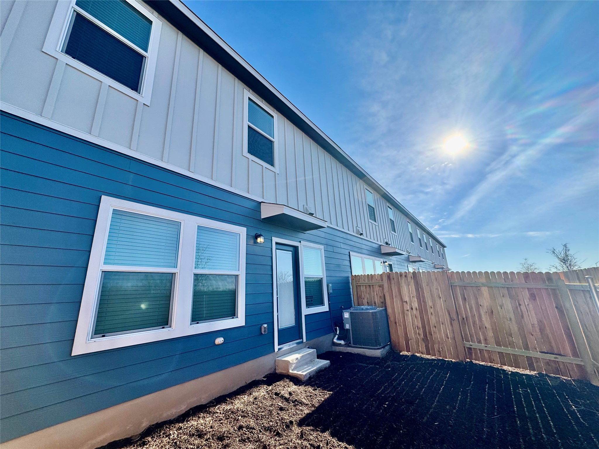104 Calcite Road, Unit 1 Kyle, TX 78640 - Photo 5 of 7 a front view of a house with a yard