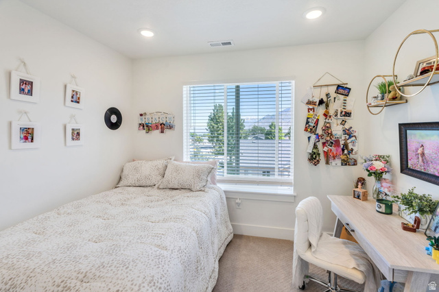 2664 West Maple Street Mapleton, UT 84664 - Photo 26 of 49 Bright room featuring a large window with horizontal blinds, recessed lighting, and light-colored carpeting